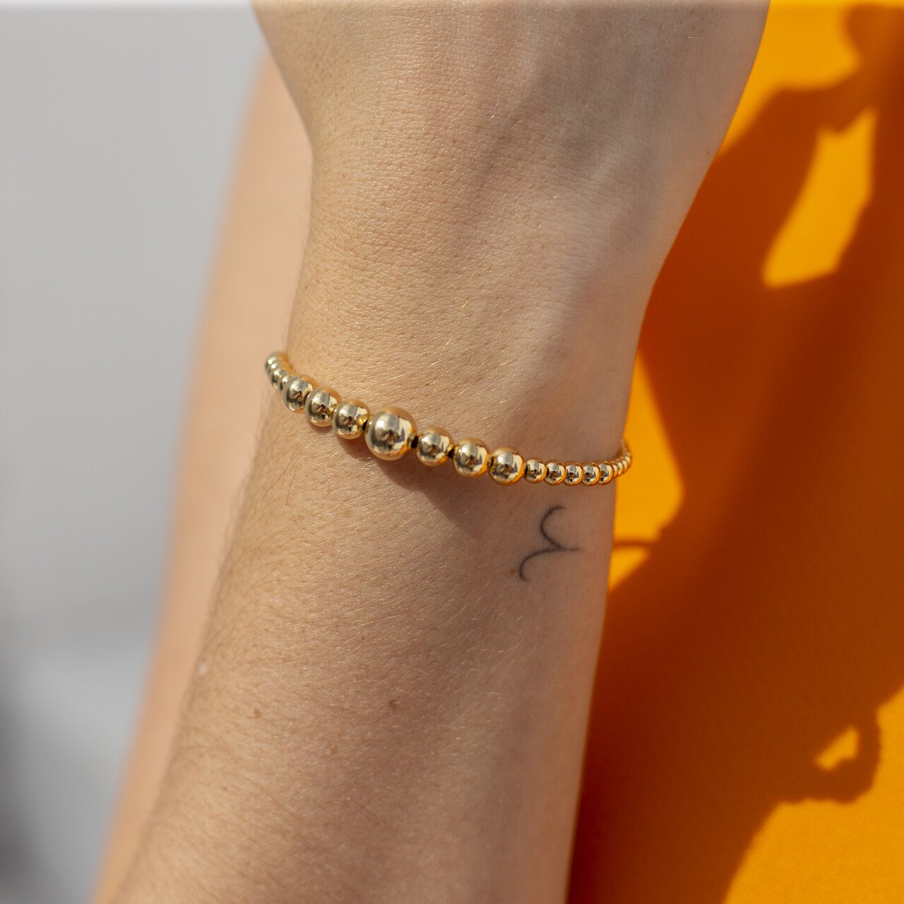 PULSEIRA MIX ESFERAS BANHO OURO