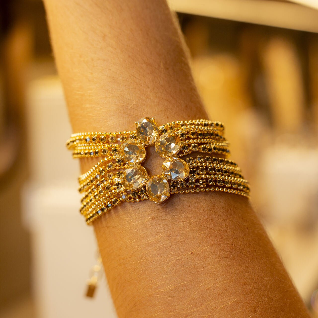 PULSEIRA FÊNIX CRISTAL CHAMPANHE BANHO OURO