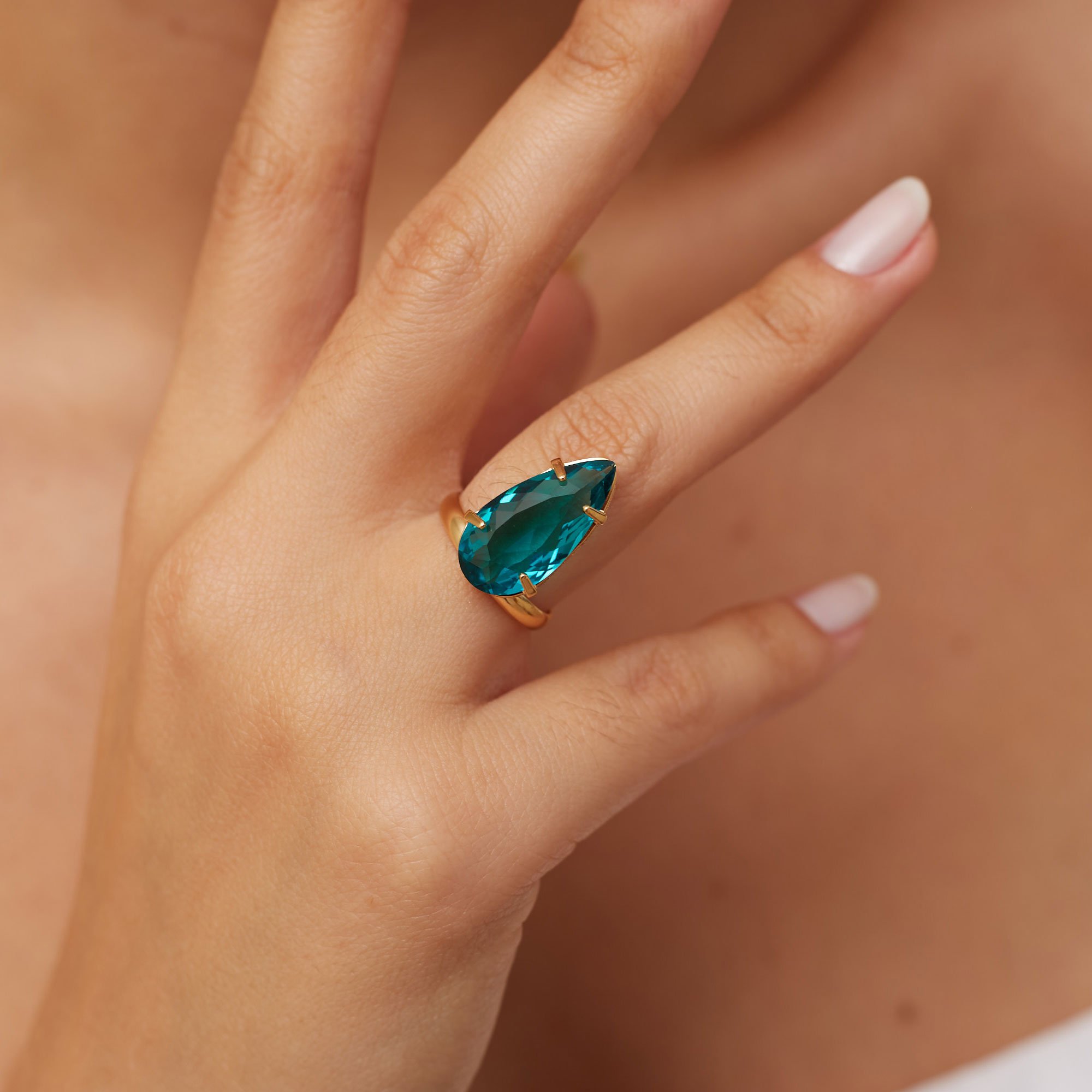 ANEL LUMINA AZUL BANHO OURO