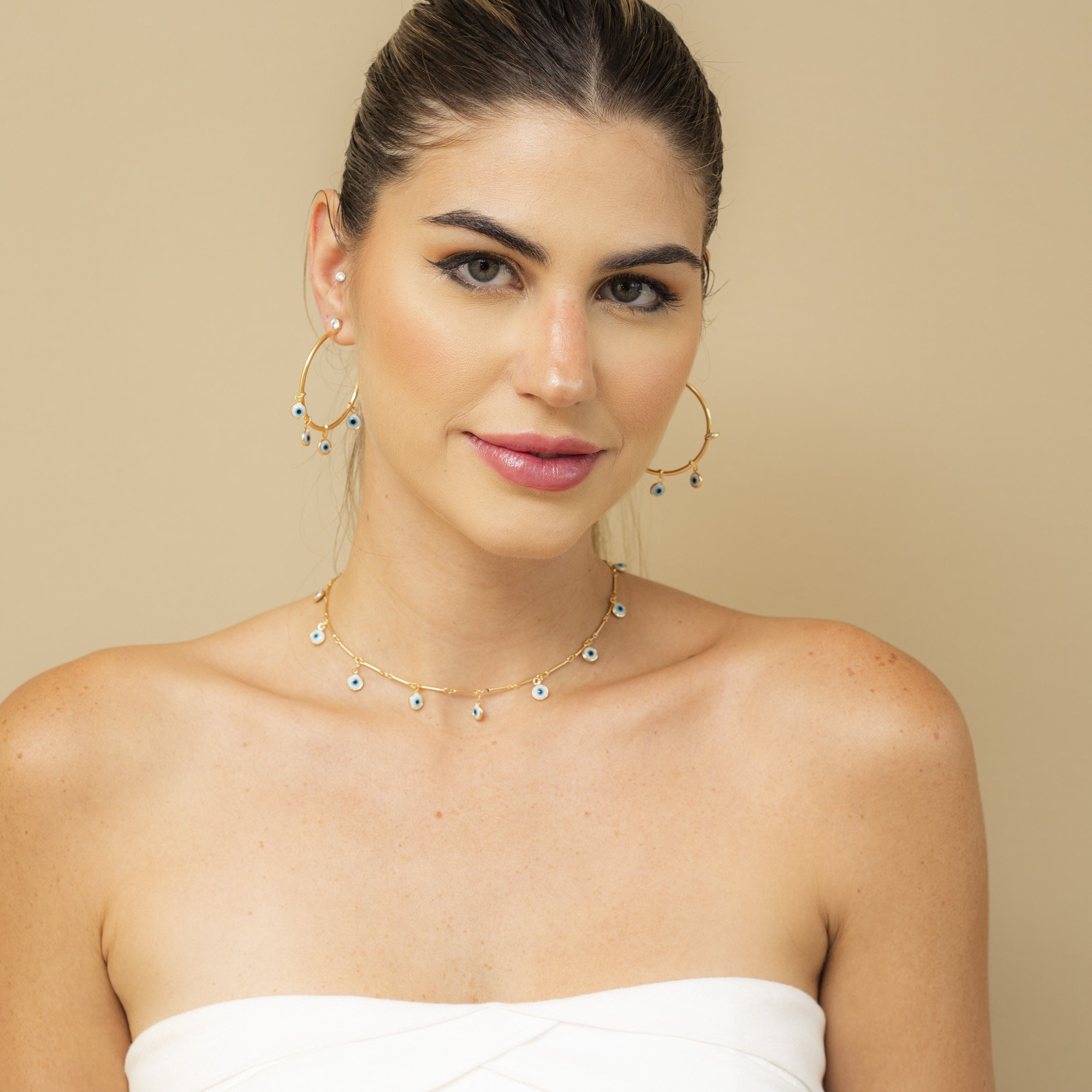 ARGOLAS PROTETOR M PINGENTES OLHO GREGO BANHO OURO