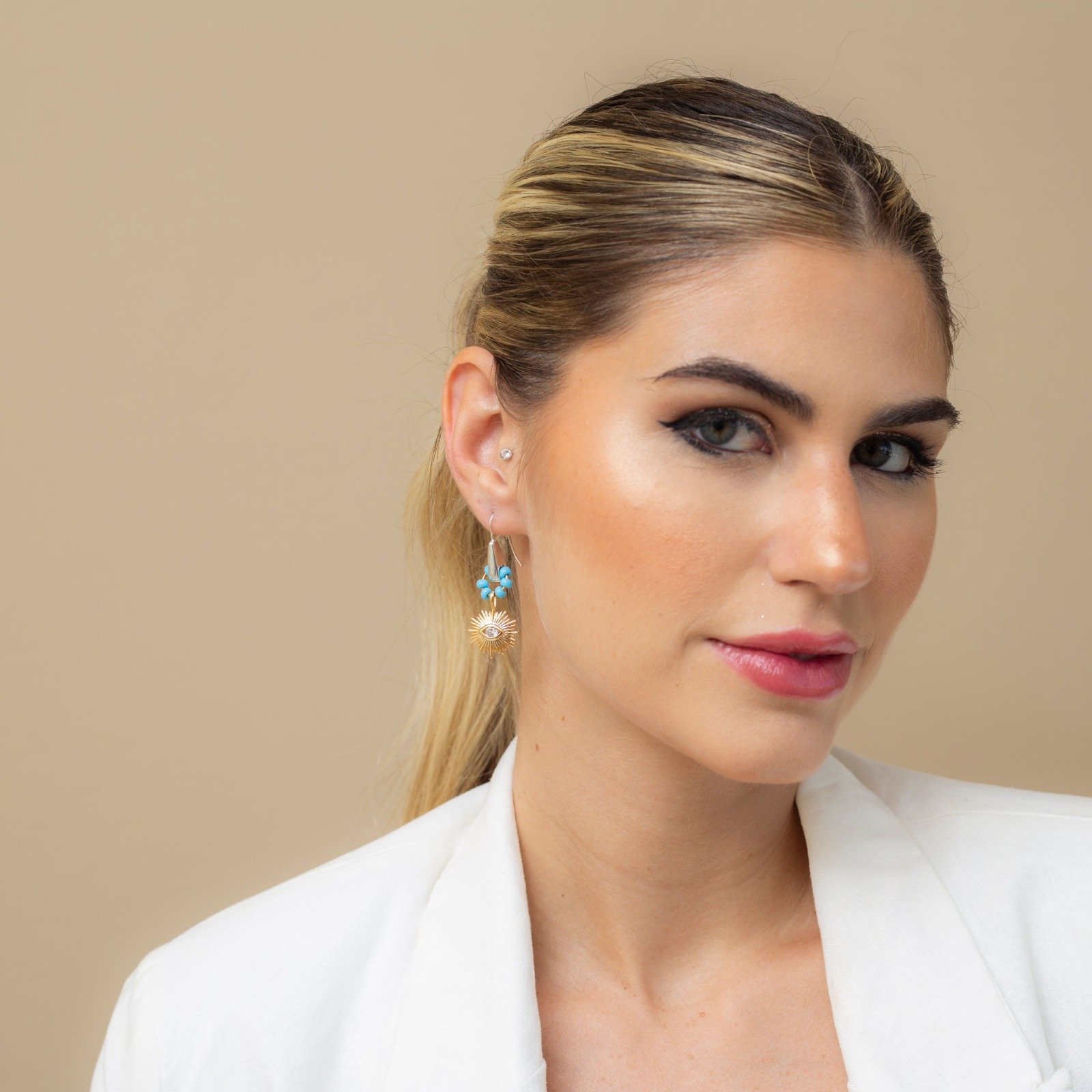 BRINCOS OLHO GREGO CRAVAÇÃO ZIRCÔNIA INCOLOR