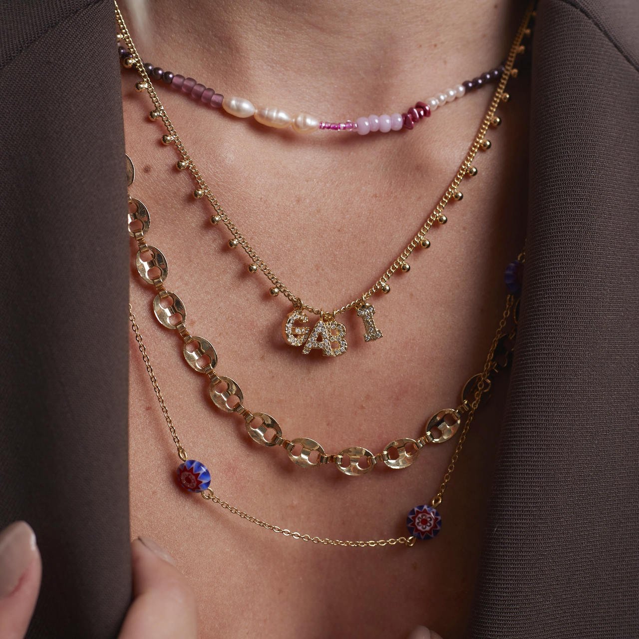 PINGENTE LETRAS CRAVAÇÃO ZIRCÔNIA BANHO OURO