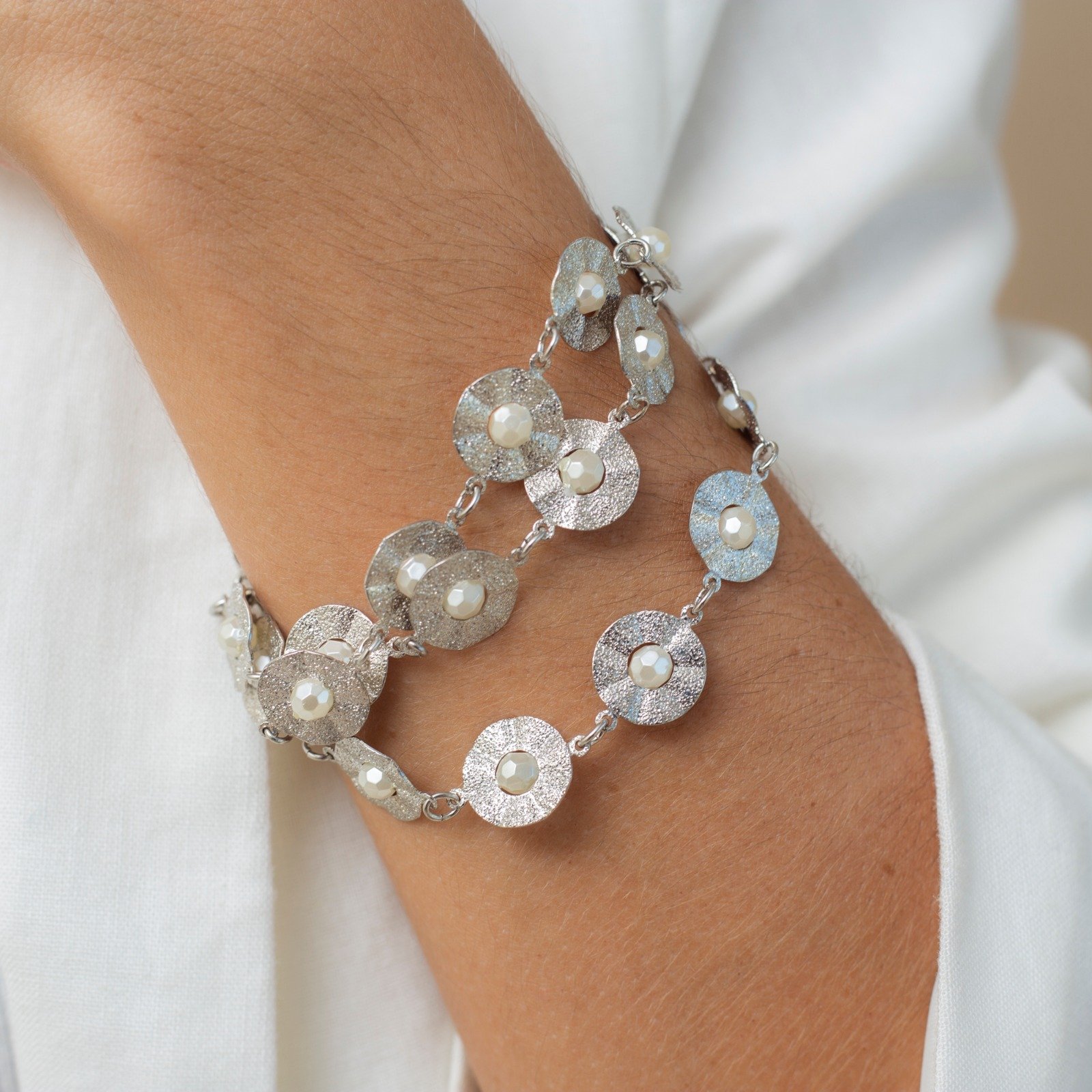 PULSEIRA DISCO PÉROLAS BANHO RÓDIO BRANCO