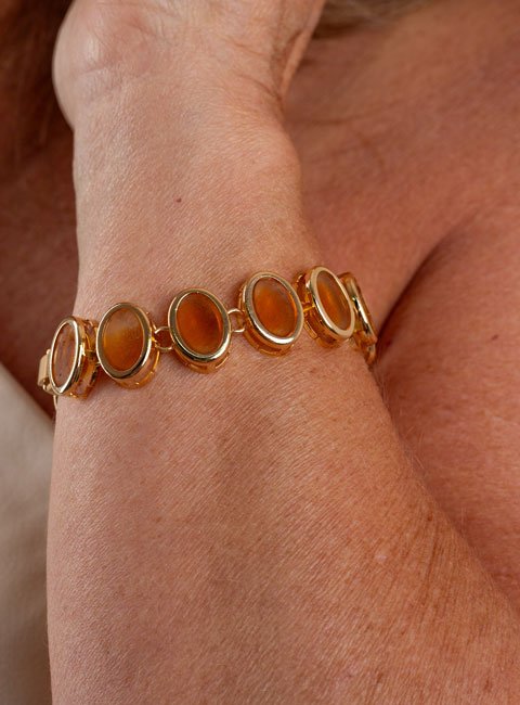 PULSEIRA ESTRO CRISTAL OVAL ÂMBAR BANHO OURO