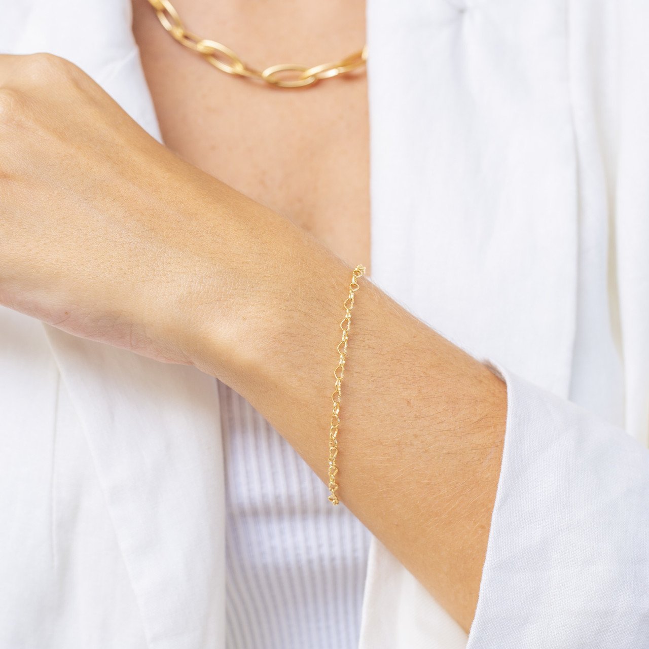 PULSEIRA MIMO CORRENTE CORAÇÃO VAZADO BANHO OURO